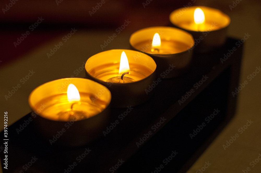 Small candles burning in the dark Small candles burning in the dark