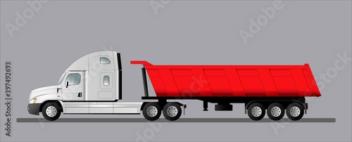 Road train with an American tractor and a 3-axle dump semi-trailer. Truck for delivering goods to a construction site.
