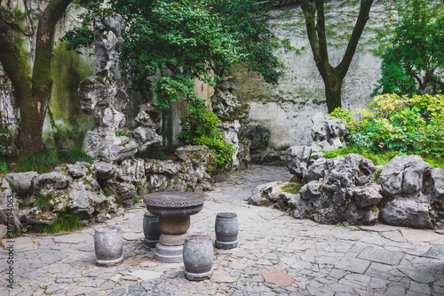 Stone table and seats in garden at Lingering Garden Scenic Area, Suzhou, Jiangsu, China