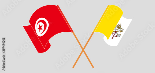 Crossed and waving flags of Tunisia and Vatican