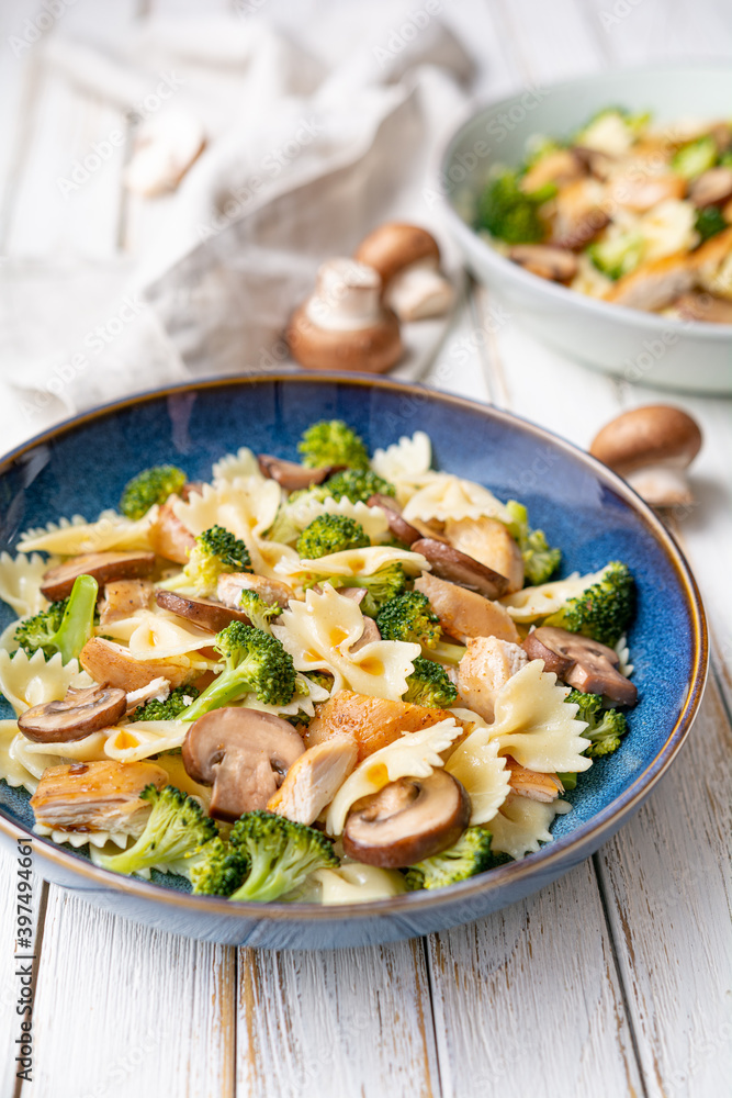 Mushroom pasta salad with steamed broccoli and baked chicken meat slices Mushroom pasta salad with steamed broccoli and baked chicken meat slices