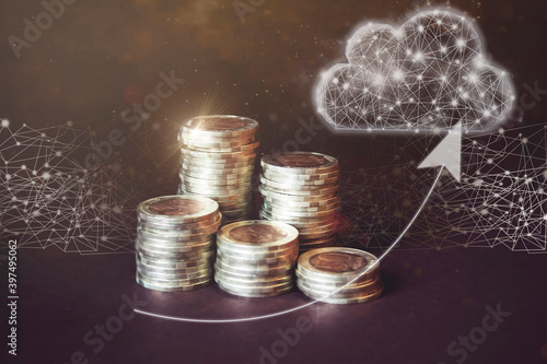 Money coin on each line rising on dark background and virtual gologram of cloud. Business saving money concept for finance accounting. Business or information technologist. photo