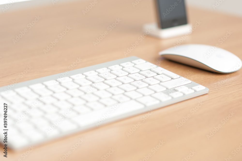 Office workplace with Apple wireless keyboard and Apple Magic mouse Office workplace with Apple wireless keyboard and Apple Magic mouse
