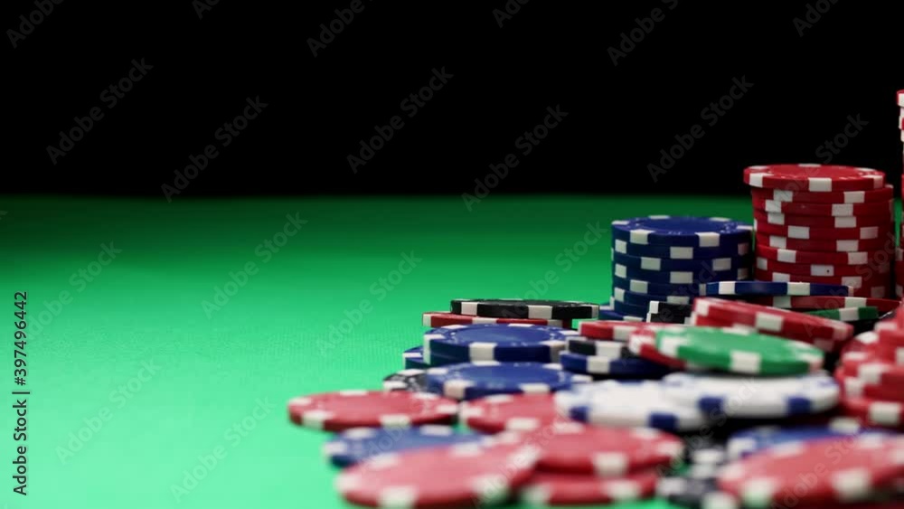 Composition of four aces and multicolored poker chips in close-up on green table. Playing at hazard games in a casino concept. Winning and losing money theme. Gambling as entertainment at leisure time Composition of four aces and multicolored poker chips in close-up on green table. Playing at hazard games in a casino concept. Winning and losing money theme. Gambling as entertainment at leisure time