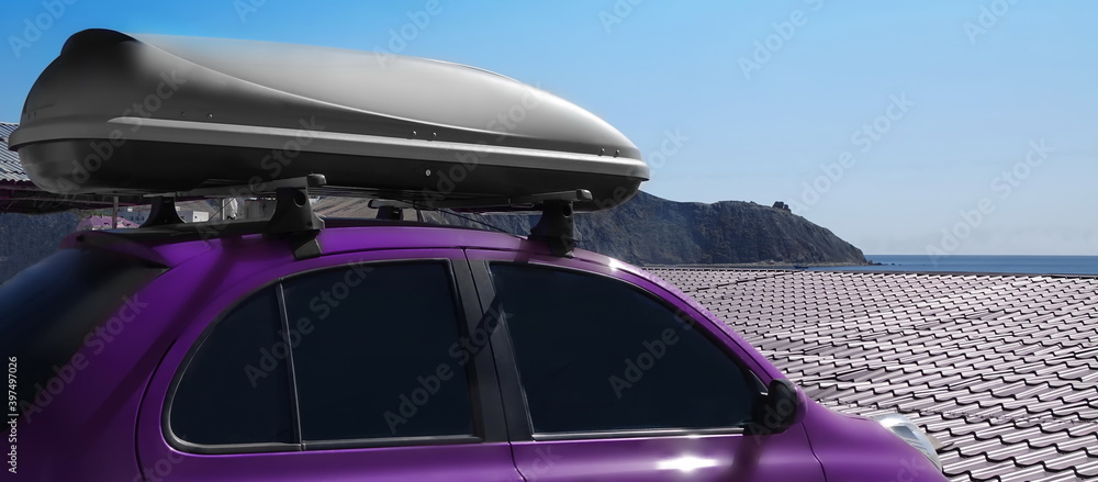 Minicar On The Sea Beach Parking With Trunk Box. Mini Car Roof With Luggage Box On Rooftop On The Rack System. Closeup View. Summer Trip Or Auto Travel Adventure Concept.