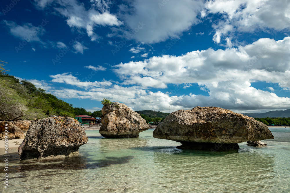 Big coral stones on the paradise beach on the rocky coast of Atlantic Ocean in Punta Rucia, Dominican Republic