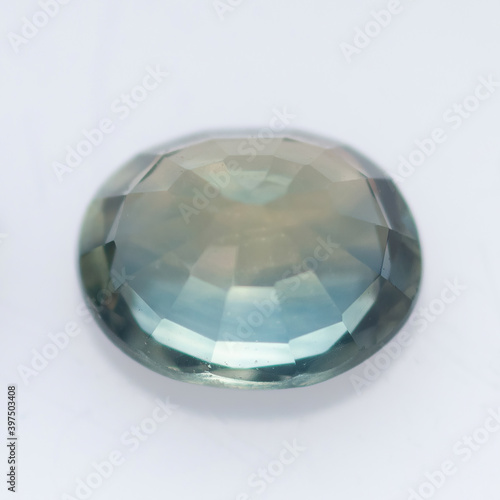 Natural blue sapphire on a white background