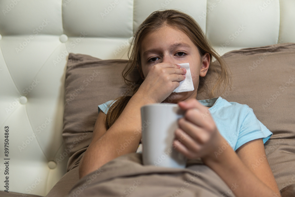 Girl with dark hair sick in bed Girl with dark hair sick in bed