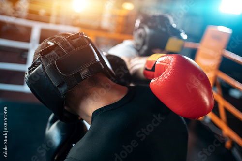 two muscle boxers sport man training and fighting on boxing ring at gym
