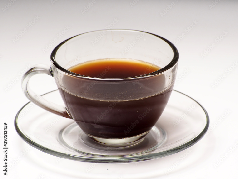 A cup of coffee and french press on a white isolated background A cup of coffee and french press on a white isolated background