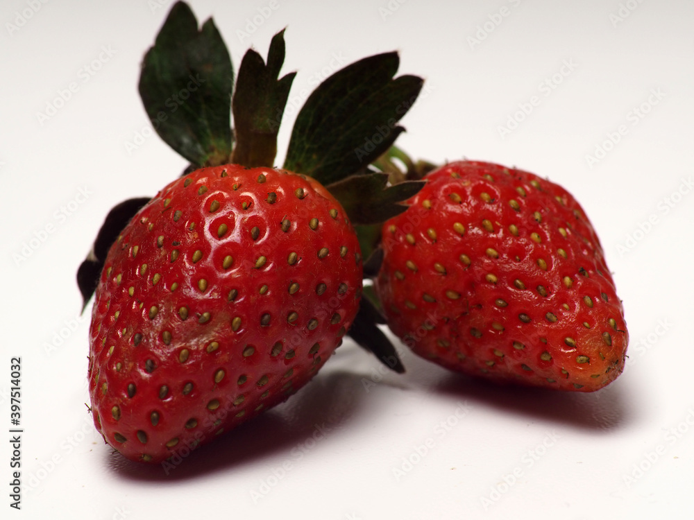 Close up shot of a group of strawberry on a white isolated background Close up shot of a group of strawberry on a white isolated background