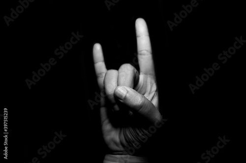 Sign language against black background