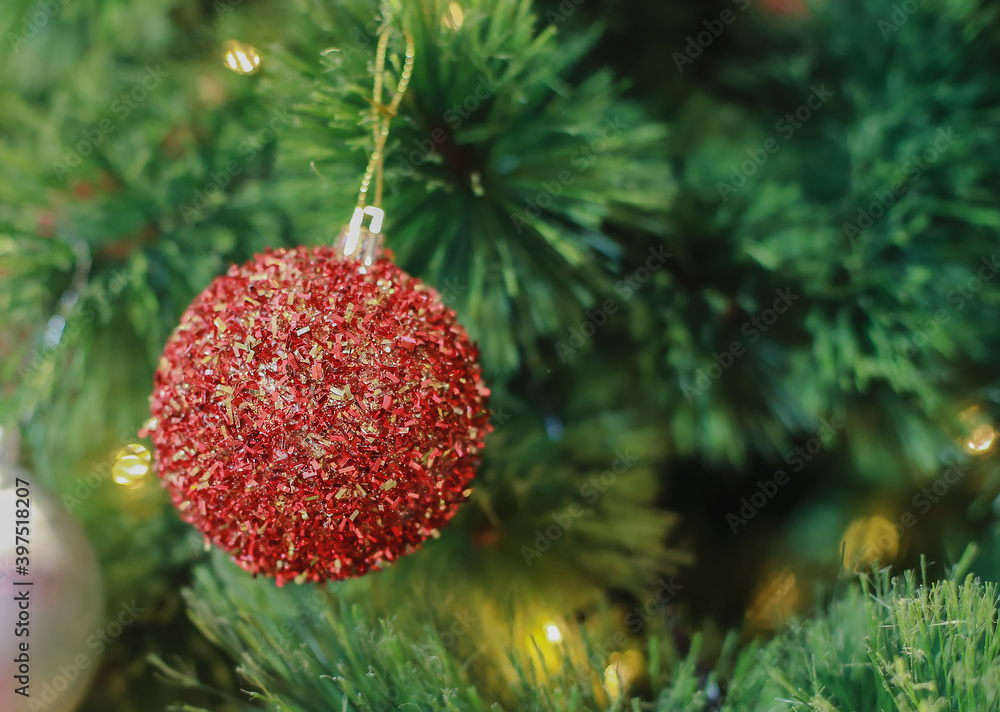 Blurry of Christmas and New Year's balls with beautiful decorations on the Christmas tree, soft light, beautiful background images and illustrations.	
