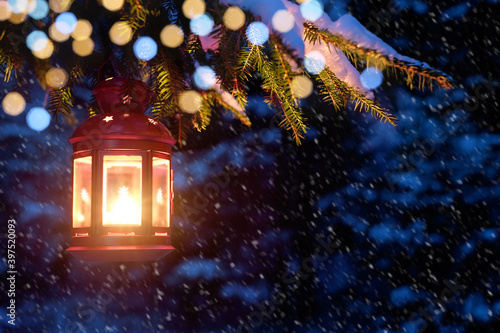 Christmas lantern on the tree in the woods. Christmas night