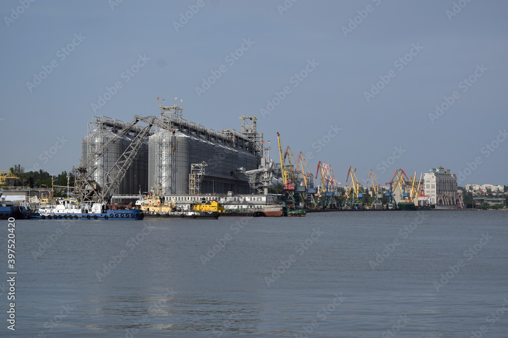 tanks and cranes in port