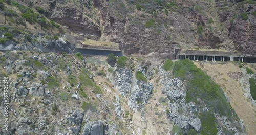 4K high quality aerial summer day footage of spectacular scenic Chapman's Peak Drive, rocky mountains, Atlantic Ocean views between Hout Bay and Noordhoek in Western Cape, Cape Town, South Africa