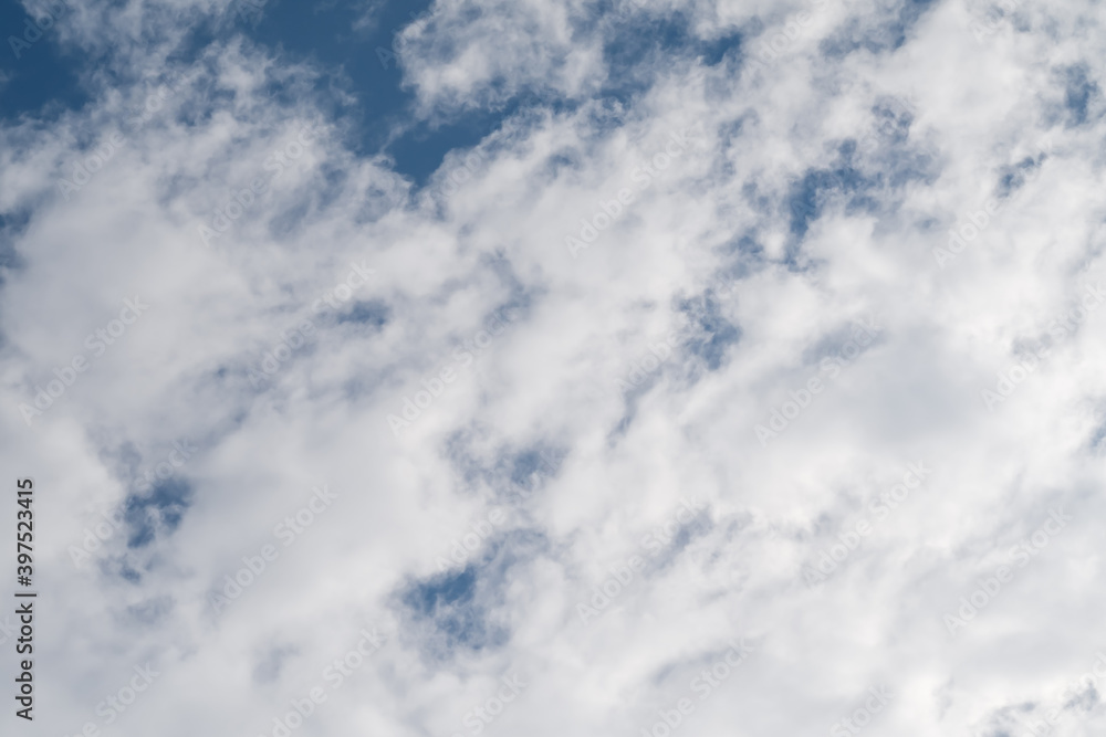Altocumulus clouds against blue sky background. Altocumulus clouds against blue sky background.