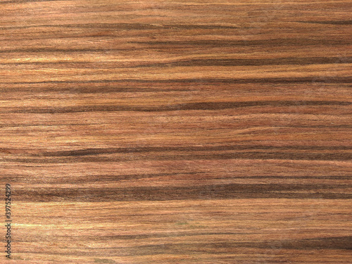 Natural earthen rose wood texture background. veneer surface for interior and exterior manufacturers use.