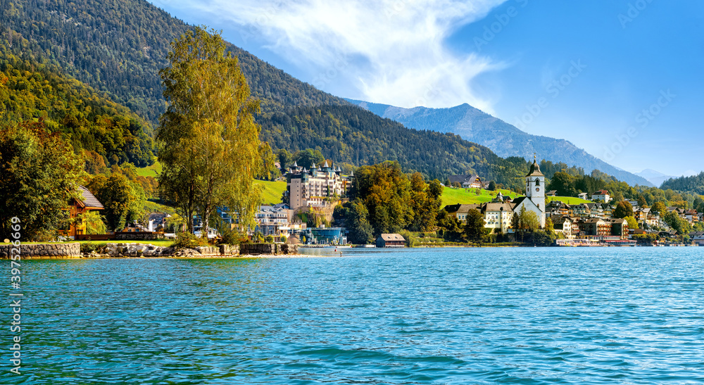 Idyllic lake shore at the Wolfgangsee on a sunny day in autumn, Austria.