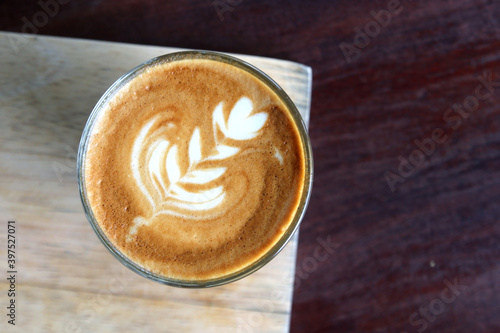 cup of hot latte art coffee