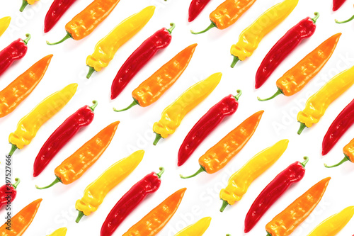 Colorful pattern of paprikas on white background. Minimal food concept.
