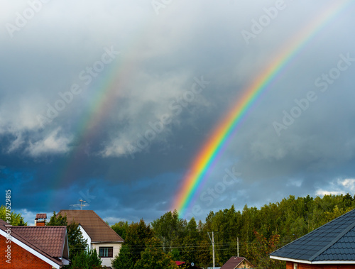 Two bright rainbows in the suburbs of Moscow during the rain © Sergey + Marina