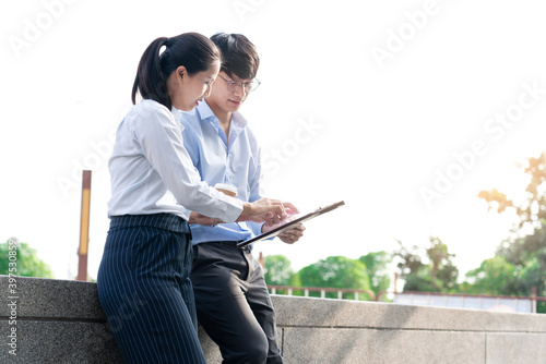 Two Business Colleagues Having Discussion new project business meeting outside office in an urban setting