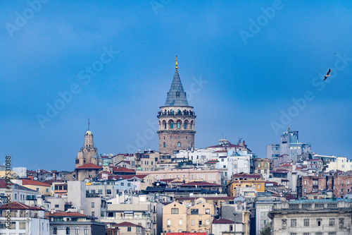 Galata town and the Tower from historical peninsula durning a ferryboat passing on Bosporus.Sky is clear partly cloudy on istanbul