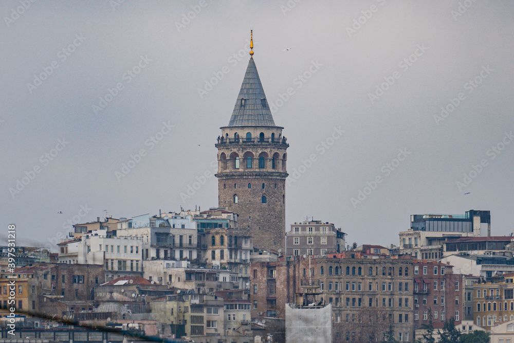 Galata town and the Tower from historical peninsula durning a ferryboat passing on Bosporus.Sky is clear partly cloudy on istanbul