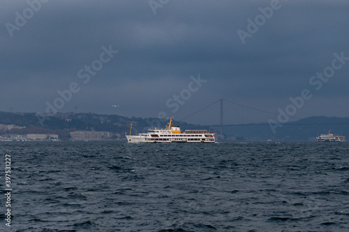Photography Boat and a ferry at the Bosporus on a cloudy day but clear weather