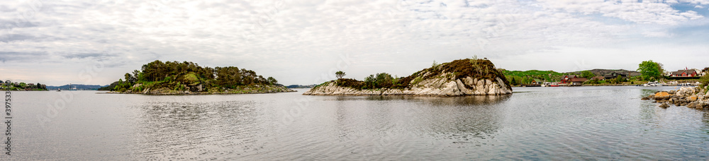 Panoramic view of small islands in a small marina harbour near Sokn island camping site, Rennesoy commune, Stavanger, Norway, May 2018