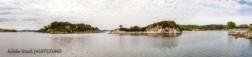 Panoramic view of small islands in a small marina harbour near Sokn island camping site  Rennesoy commune  Stavanger  Norway  May 2018