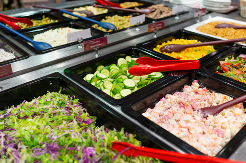 Schilderij op canvas Variety of fresh colorful vegetable and fruit at salad bar corner