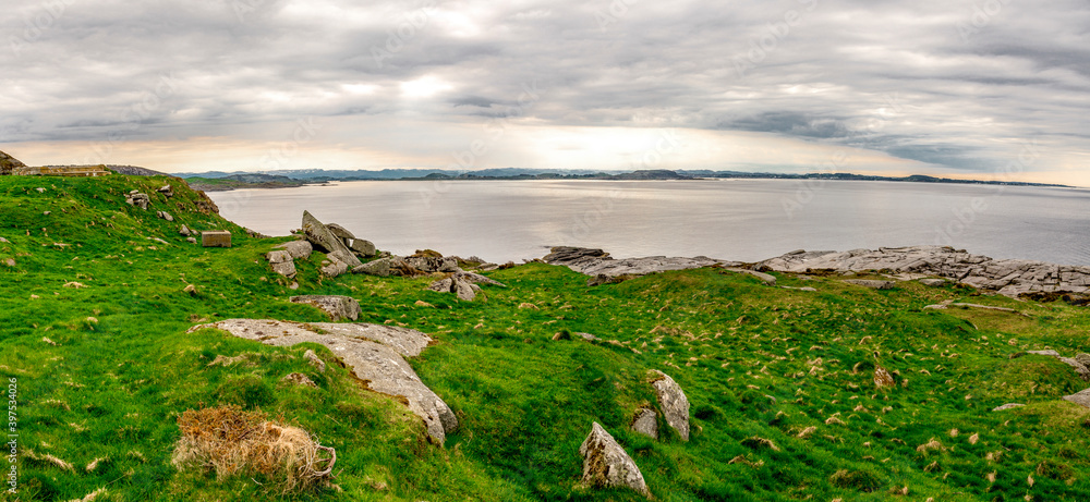 Fjoloy island green and rocky landscape near Fjoloy fort historical site, Rennesoy kommune, Stavanger, Norway, May 2018