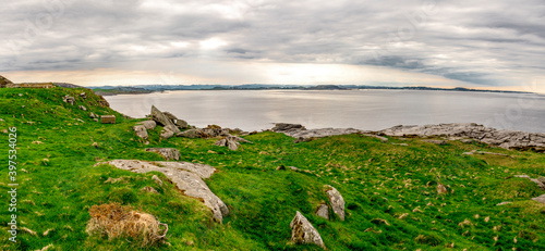 Obraz na płótnie Fjoloy island green and rocky landscape near Fjoloy fort historical site, Rennesoy kommune, Stavanger, Norway, May 2018 w salonie