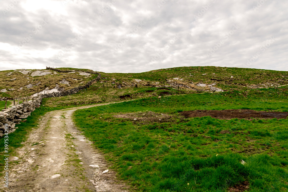 Start of a short hiking track to Mastravarden top hill at Mosteroy island, Rennesoy commune, Stavanger, Norway, May 2018