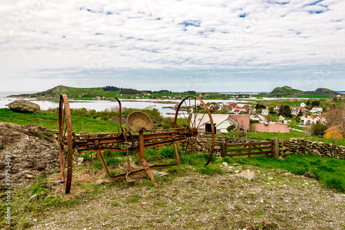 Old and rusty abandoned agricultural device on Mosteroy island, Rennesoy kommune, Stavanger, Norway, May 2018 photo