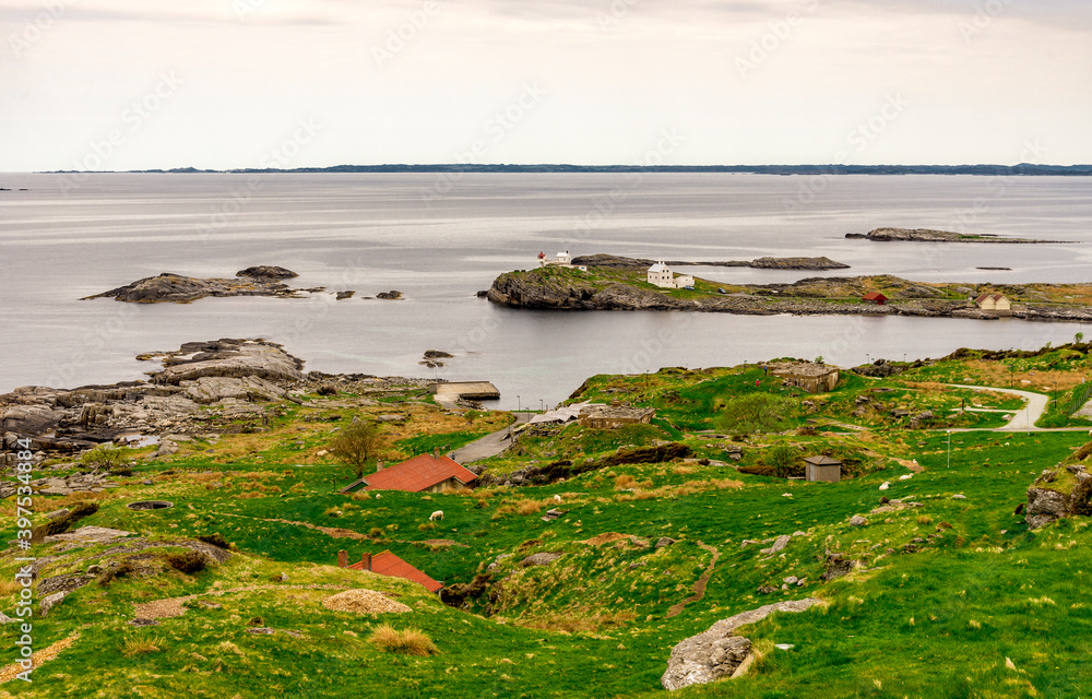 A panoramic scenic view to Fjoloy fort site and lighthouse from the top of the hill, Rennesoy kommune, Stavanger, Norway, May 2018 A panoramic scenic view to Fjoloy fort site and lighthouse from the top of the hill, Rennesoy kommune, Stavanger, Norway, May 2018