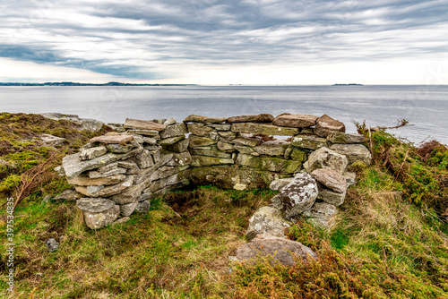 Obraz na płótnie One of the old sentry fortifications made of rocks which surround historical Fjoloy fort, Rennesoy kommune, Stavanger, Norway, May 2018 w salonie