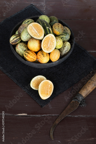 Organic Fresh Healthy Vegetable Yellow Cucumbers or Yellow Pumpkin on Wooden Background photo