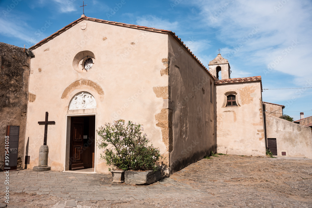 Fototapeta premium Church in the old village of Populonia. View at the Church of Santa Croce in Populonia town - Italy