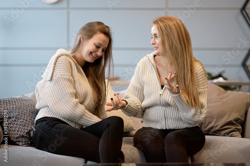 Картината върху платно Happy senior mother embracing adult daughter laughing together, smiling excited