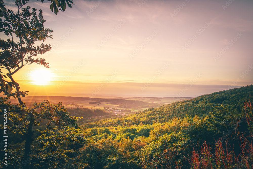 Beautiful landscape in the mountains, great views of nature. Sunset, forest trees, meadow bushes. Nice distant horizon and plantings. unique atmosphere with great clouds