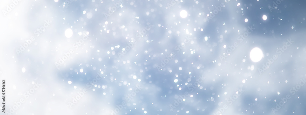 Fototapeta premium blue snowfall bokeh background, abstract snowflake background on blurred abstract blue