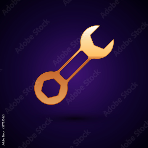 Gold Wrench spanner icon isolated on black background. Vector.
