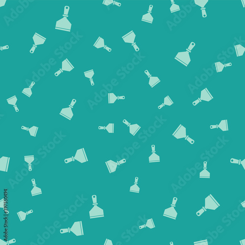 Green Putty knife icon isolated seamless pattern on green background. Spatula repair tool. Spackling or paint instruments. Vector.