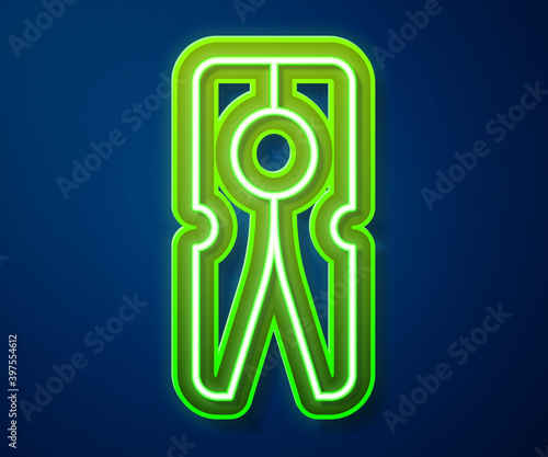 Glowing neon line Old wood clothes pin icon isolated on blue background. Clothes peg. Vector.