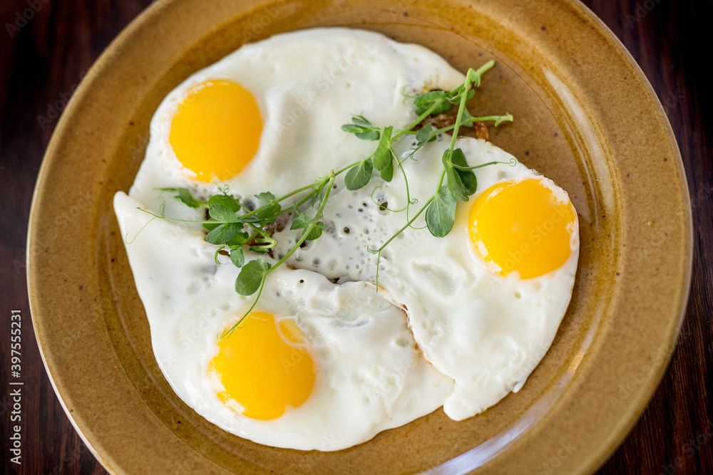 Scrambled eggs for breakfast from three eggs. Fried eggs.