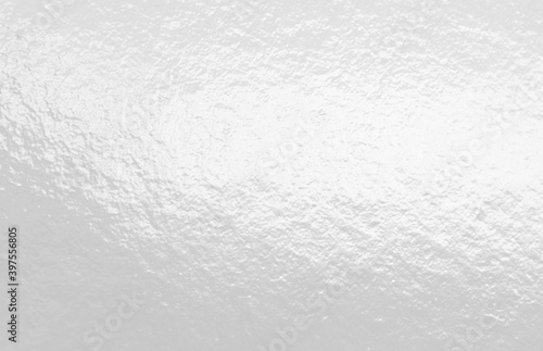 White glossy foil texture background with uneven surface