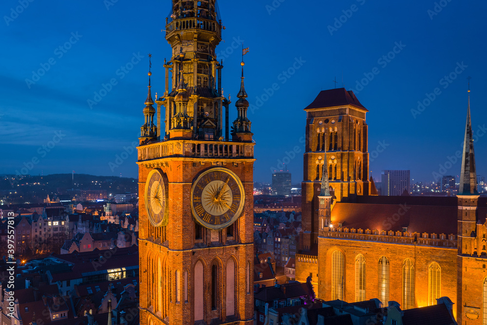 Fototapeta premium Beautiful clock of the town hall in Gdansk at night, Poland